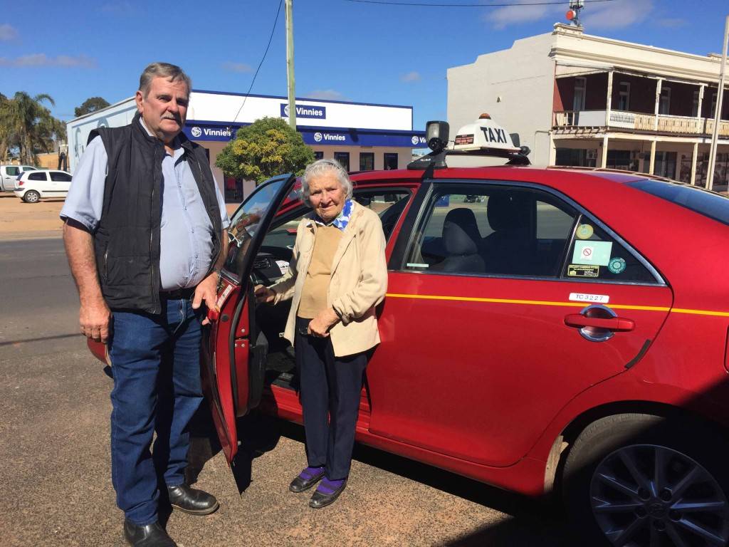 Local taxi driver Ray Wilson with Home Care client Peg Coughlan on Monday.