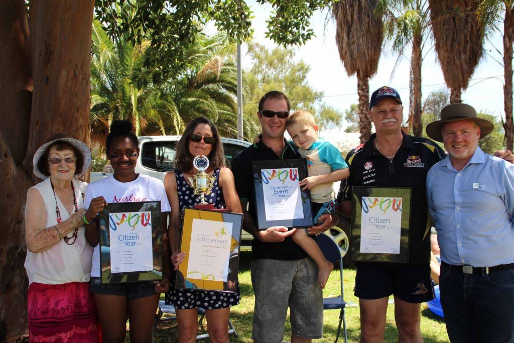 The 2016 Australia Day awards were presented yesterday at the Cobar Memorial Swimming Pool by mayor Lilliane Brady and Cobar’s Australia Day ambassador Andrew Heslop (far right). This year’s winners were: Annie Mugugia (Young Citizen), Kay Stingemore (Bossie Mitchell Services to the Community), Ben Hewlett (holding his son Noah) (Community Event of the Year—ANZAC Ball) and John de Bruin (Citizen of the Year). See Page 4 for the list of all nominees and details about the winners.