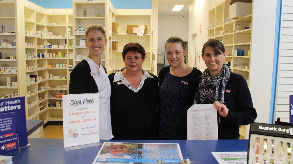 The John Mitchell Pharmacy is one of the many places in town where the public can sign a petition to show their support for a cancer centre at Dubbo Hospital. Shown above with the petition are Pharmacist Shannon Eves with pharmacy employees Diane Slater, Chloe Neumann and Michelle Chandler.  