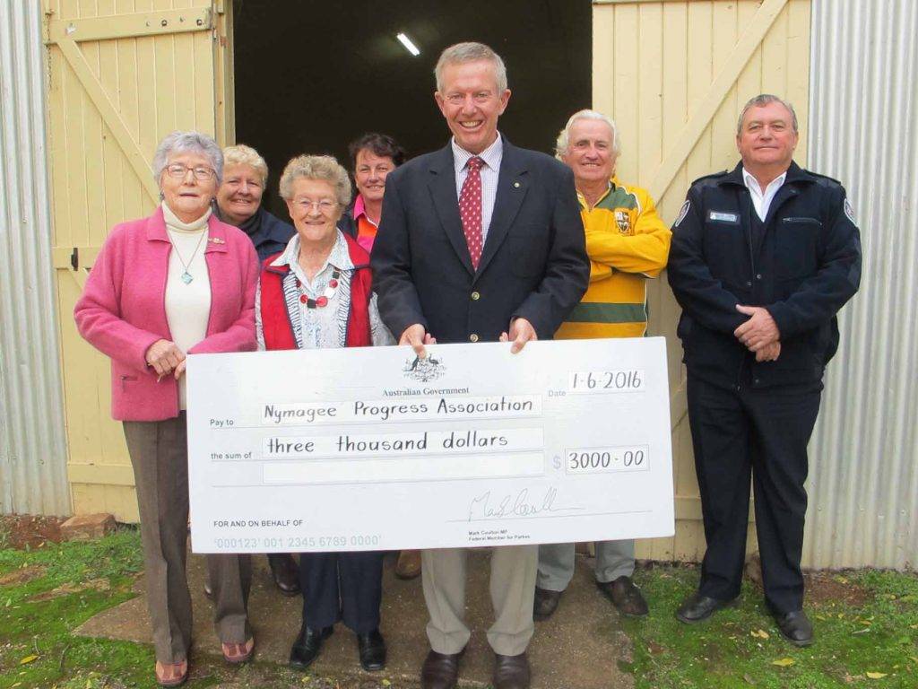 Mark Coulton presented a $3,000 cheque to members of Nymagee Progress Association last week to assist with the restoration of a local Honour Board recognising local  servicemen and women. ▪ Photo contributed 