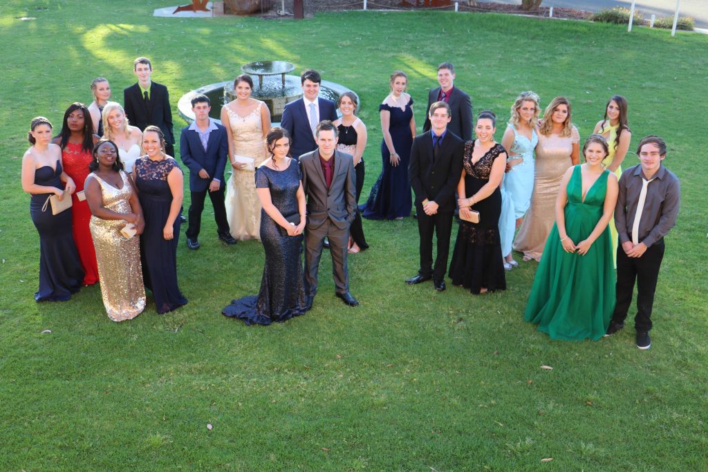 The Cobar High School Year 12 Class of 2016 looked sensational in their formal attire last Thursday night when they reunited for their final official school function, a farewell dinner at the Cobar Bowling & Golf Club. Pictured are the class members: Molly Hogan,  Joana Awuku, Jennifer Awuku, Kaitlyn Raffaele, Billie Hall, Josh Burley, Stephanie Bastian, Taylor Hooker, Zara Ralph, Annette  Hudson, Bryan Mitchell, Robert Good, Kaitlyn Byrne, Stephanie Cartner, Tyler Whittaker-Goodwin, Blake Toomey, Gabriella  Lennon, Brooke Hartman, Madeline Brookman, Niamh Urquhart, Bonnie-Ann Martin and Kody Martin during their photo shoot on the lawns of the Great Cobar Heritage Centre. While some of the students have already worked out where their futures will take them next year and beyond, many, particularly those planning to go on to further study, are still nervously waiting for their HSC results which won’t be available until the middle of next month.  